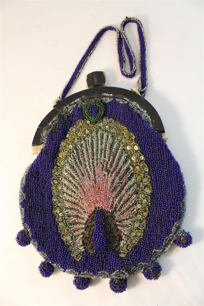 French Beaded Peacock Art Deco Purse: Beautiful Art Deco Period French Made Beaded Purse. With Bakelite closer in two colors. Beautiful peacock form beaded design. Interior lined and has original matching mirror. Measures 9” by 6-1/2”