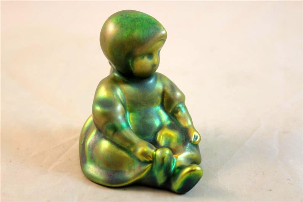 Zsolnay Pecs Eosin Hungarian pottery little young g: TA Hungarian Zsolnay Pecs Eosin glazed green iridescent little young girl sitting. Marked on the bottom with there mark. 3x3x2