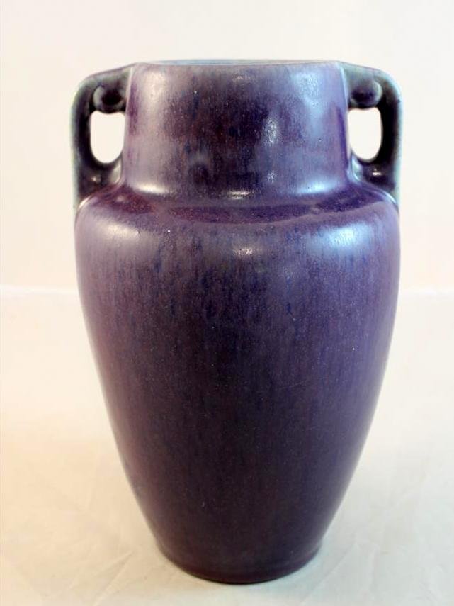 Art Deco Fulper Purple Glaze Handled Vase 1920's: a nice Art Deco 1920's period Fulper American Art Pottery Vase. Glazed in a grape purple colored glaze. A double handled tapered shape body. Marked on the bottom with a vertical oval racetrack mark. 9
