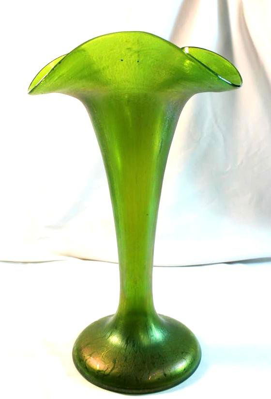 Large Loetz Glass Green Papillon Trumpet Ruffled Va: High QUality Antique Early 1900's Loetz Glass vase. Green Iridescent Spotted glass called Papillon. Blown Glass with a trumpet form wide flat bottom foot. Large Tri-form ruffled top. 12" by 7"