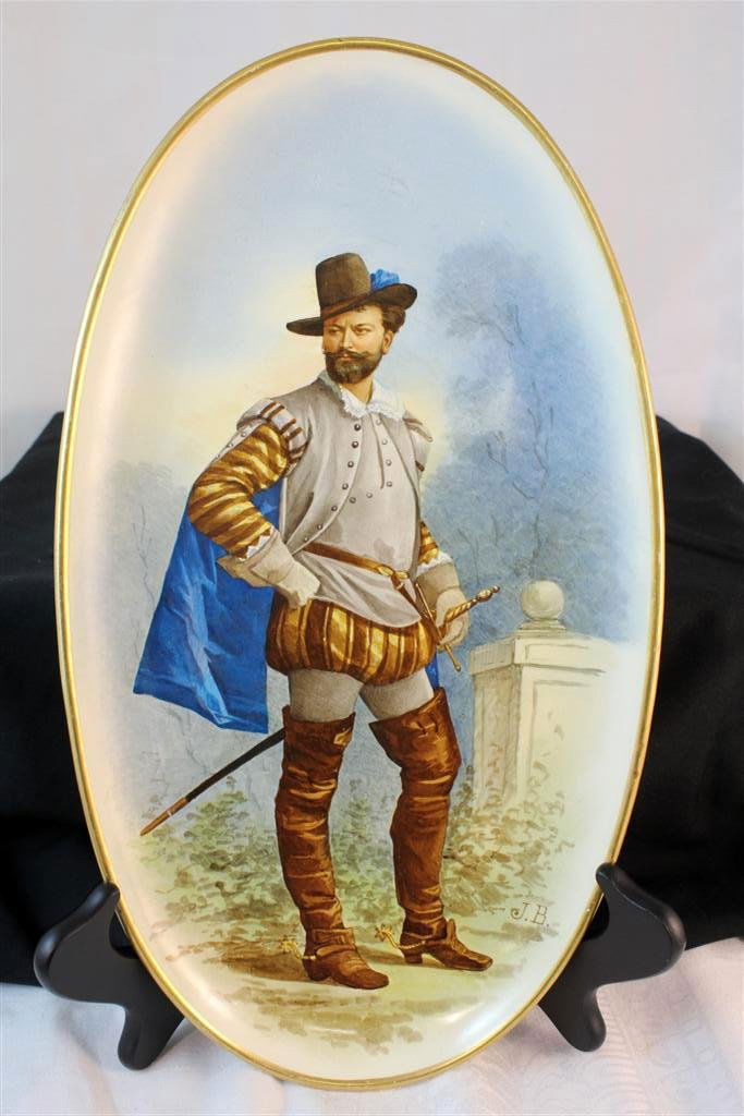 Hautin & Boulanger Chiosy-Le-Roi French Enamel Plat: A fantastic antique Earthenware plate. Made in Choisy-Le-Roi, France at the Hautin & Boulanger factory Circa 1890-1900. A large oval plate with a gorgsou hand painted portrait of a soldier - Musketeer