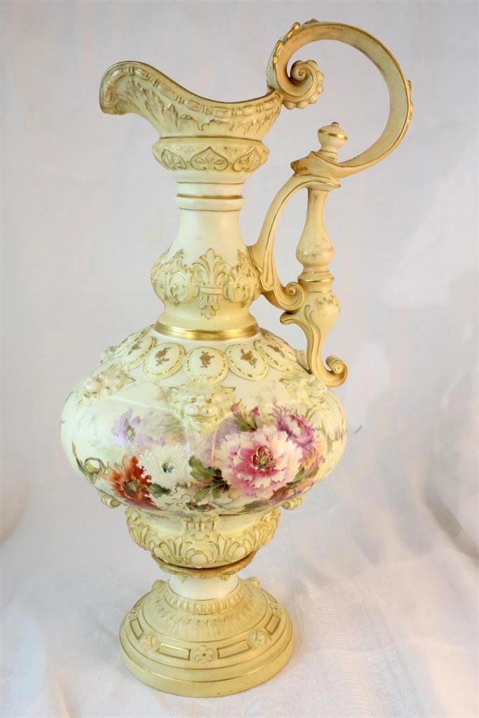Royal Rudolstadt Large Ewer Pitcher Lions Heads Flo: Gorgeous 19th CEntury Royal Rudolstadt German porcelain ewer or pitcher. A large piece in ivory color ground. Almost identical to Worcester porcelain of the same time period. Very ornate molded design