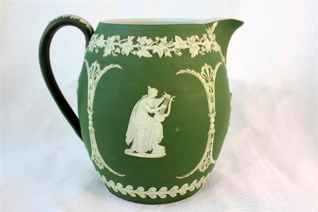 Antique Wedgwood Jasperware Green Pitcher Figural: Gorgeous antique English Wedgwood Jasperware pitcher. A large pitcher in deep green with white jasperware applied Figures, Acanthus leaves, flowers, lyre & flute, scrolls and more. measures 5" by 4-1/