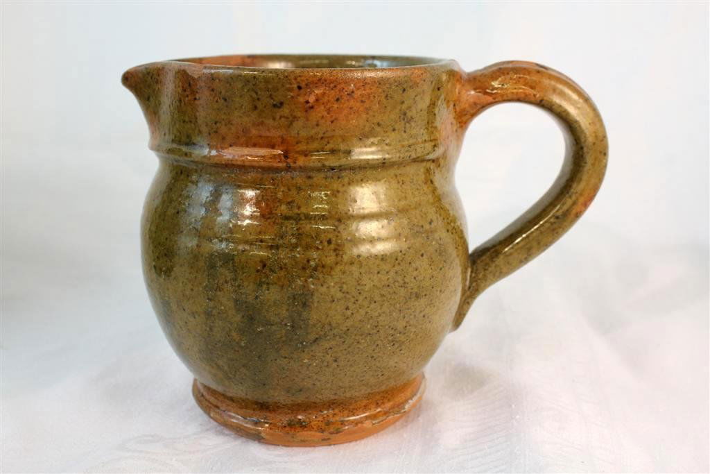 1938 Stahl's Pottery Pitcher Creamer by Thomas Stah: Wonderful vintage American art pottery small pitcher or creamer. A light brown glazed color on Redware. Made at the Stahl's pottery factory by Thomas Stahl. Signed on the bottom and dated 1938. measur