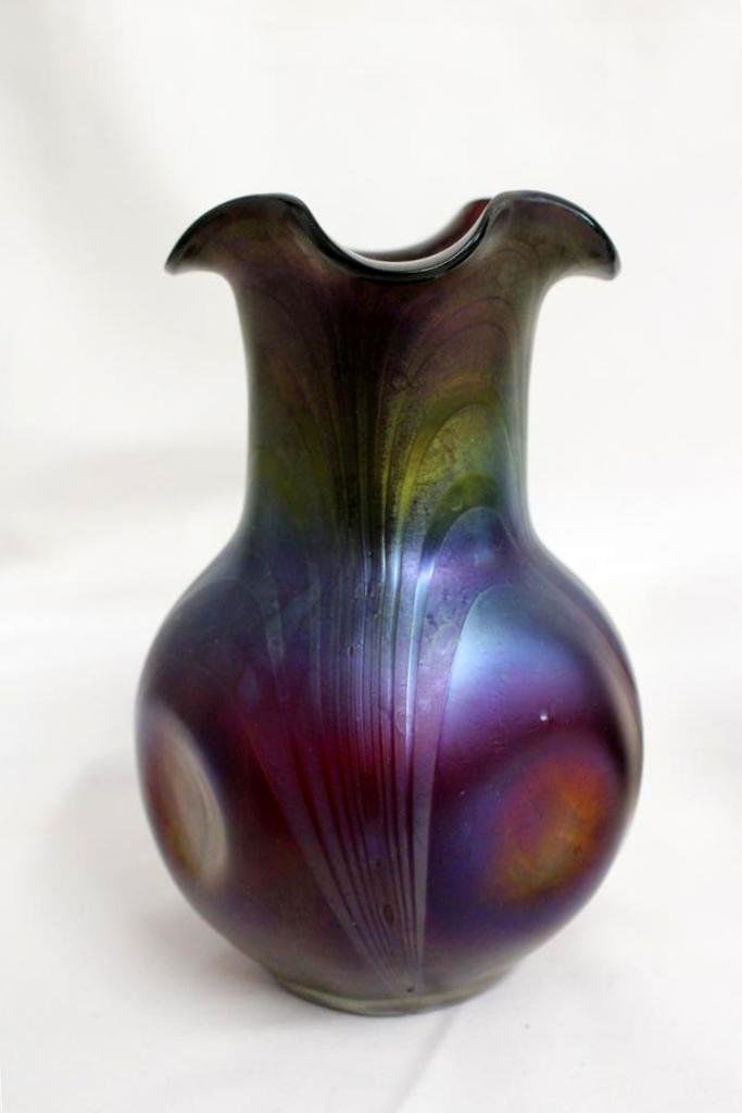 Gorgeous Loetz Kralik Amethyst Iridescent Dimpled Vase: Beautiful antique Czech glass vase. Either Loetz or Kralik glass factory. In a bulbous body form with ruffled rim. Dark amethyst color with beautiful iridescent pulled lines down the sides. With dimpl