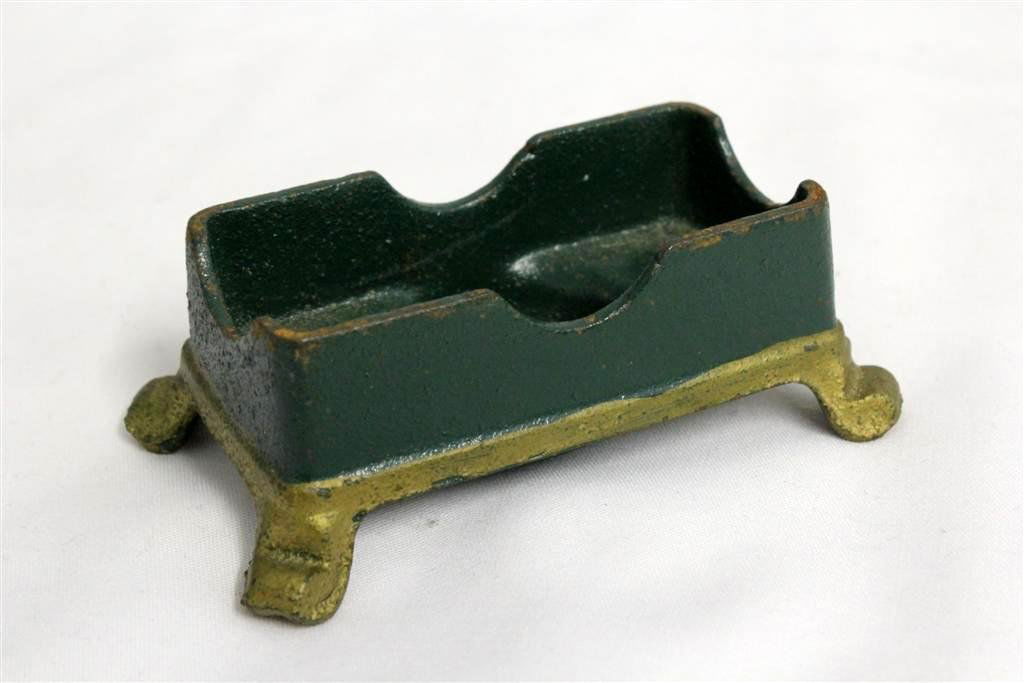 W.H. Young Cast Iron Match Holder Toothpick: Nice Vintage Cast Iron green and gold painted toothpick or match holder. Marked on the bottom W.H. Young Wrightsville PA. Measures 4” by 2” by 1-1/2”.