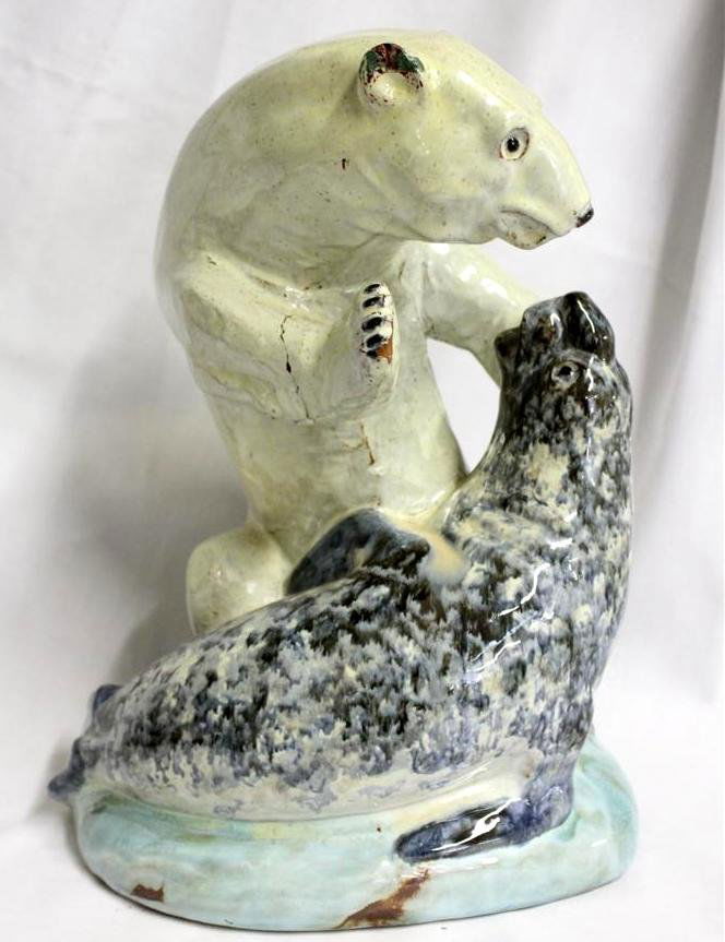 G.E. Island Pottery 1951 Polar Bear & Elephant Seal: Fantastic RARE Redware Art Pottery Sculpture. Hand Sculpted in the form of a large fierce polar bear fighting with an Elephant Seal. Made in 1951 marked on the bottom with a mountain looking mark carv