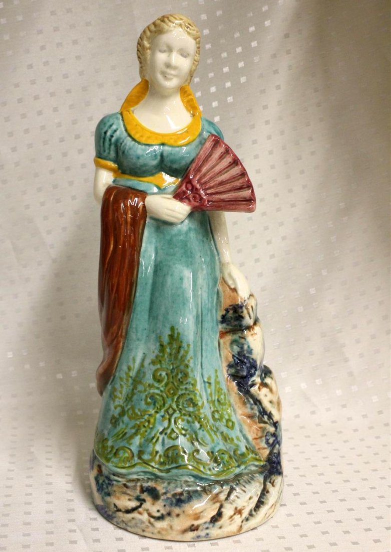 Fourmaintraux Desvres Faience Majolica Female Figure: A vintage French Faience Majolica figure of a woman holding a fan. Made by the Fourmaintraux pottery company in Desvres France. 10” tall