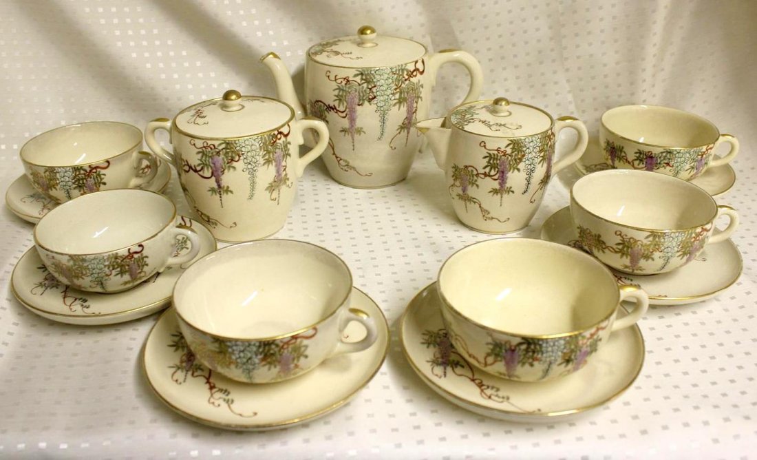 Meiji Period Shuzan Satsuma Shimazu Wisteria Tea Set: Stunning Antique Meiji Period late 1800's. Japanese Shuzan Studio Satsuma pottery tea set. Marked on the bottom with the Shuzan mark & the Shimazu Family Crest mark. Enamel decorated with wonderful Wi