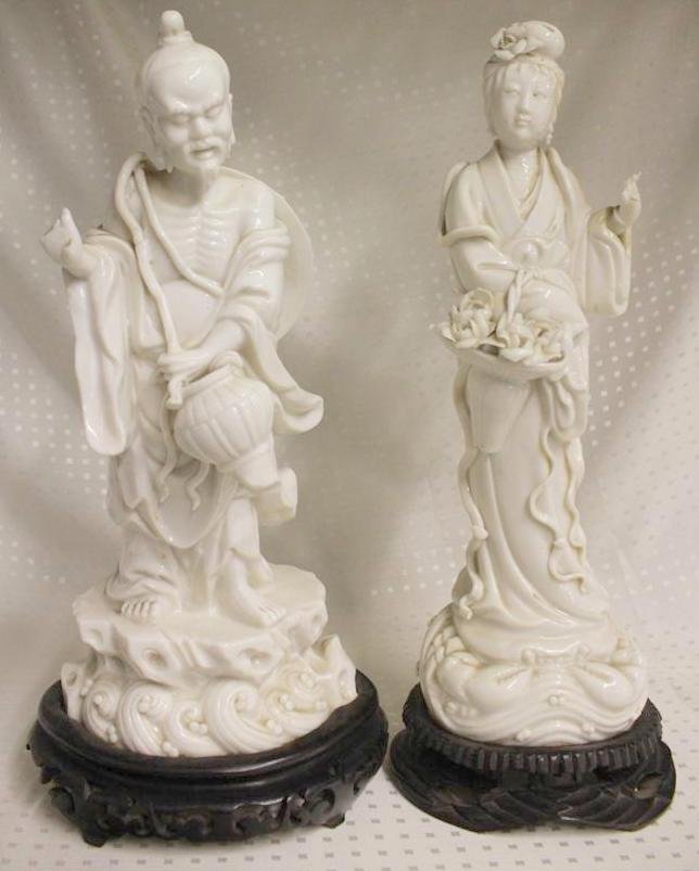 Pair of Chinese Blanc De Chine Porcelain Figures: Nice Pair of Vintage Chinese Blanc De Chine Porcelain Figures. One of an old man with large hat on his back holding a vessel with long draped robe. He has a square impressed mark on his back, but it d