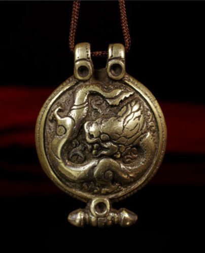 Old Tibetan Buddhist Bronze Amulet: Old Tibetan Buddhist bronze Amulet inlaid with dragon motif , pre 1900 , size: 4.4 X 3.1 CM