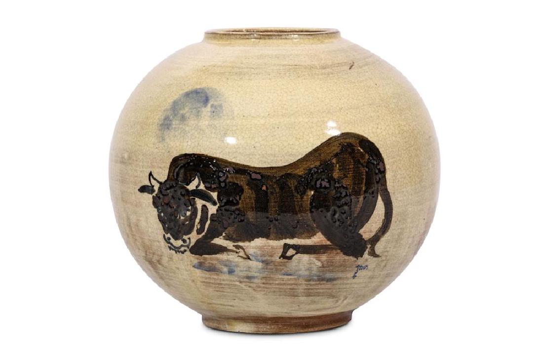 A CREAM GLAZED ‘OX’ JAR. Korea. The: A CREAM GLAZED ‘OX’ JAR. Korea. The globular body supported on a short foot and rising to a lipped rim, the body painted in brown slip with a seated ox, 22cm H. 朝鮮 
