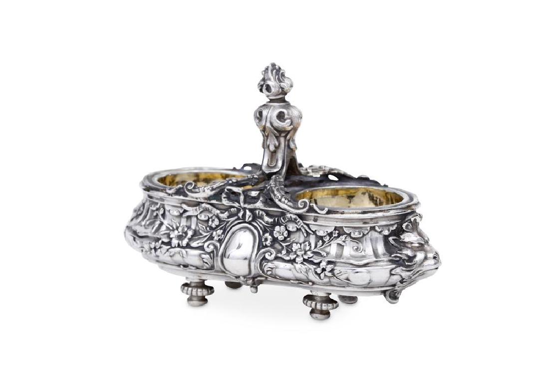 A French 950 standard silver twin salt, by Alphonse: A French 950 standard silver twin salt, by Alphonse Debain (active 1883-1911), also with later Russian Soviet marks for Moscow by M106-V Of waisted oval rectangular form, with embossed decoration of f