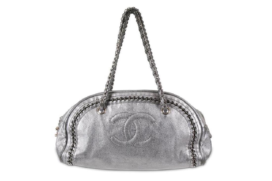 Chanel Metallic Silver Bowler, c. 2005-06, from the: Chanel Metallic Silver Bowler, c. 2005-06, from the collection entitled 'Luxury by Chanel', chain detail to leather body with silver tone hardware, 33cm wide, 19cm high, 20cm shoulder drop Condition G