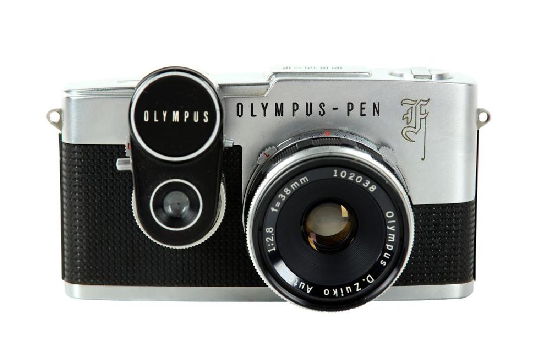 A Olympus Pen F Half Frame SLR Camera: A Olympus Pen F Half Frame SLR Camera Serial No: 127416 Body: G/VG Shutter: Working Lens: Olympus 38mm f/1.8 Zuiko Auto-S (102038) Optics: VG Notes: Gothic 'F' with Pen meter, and makers ERC, small d