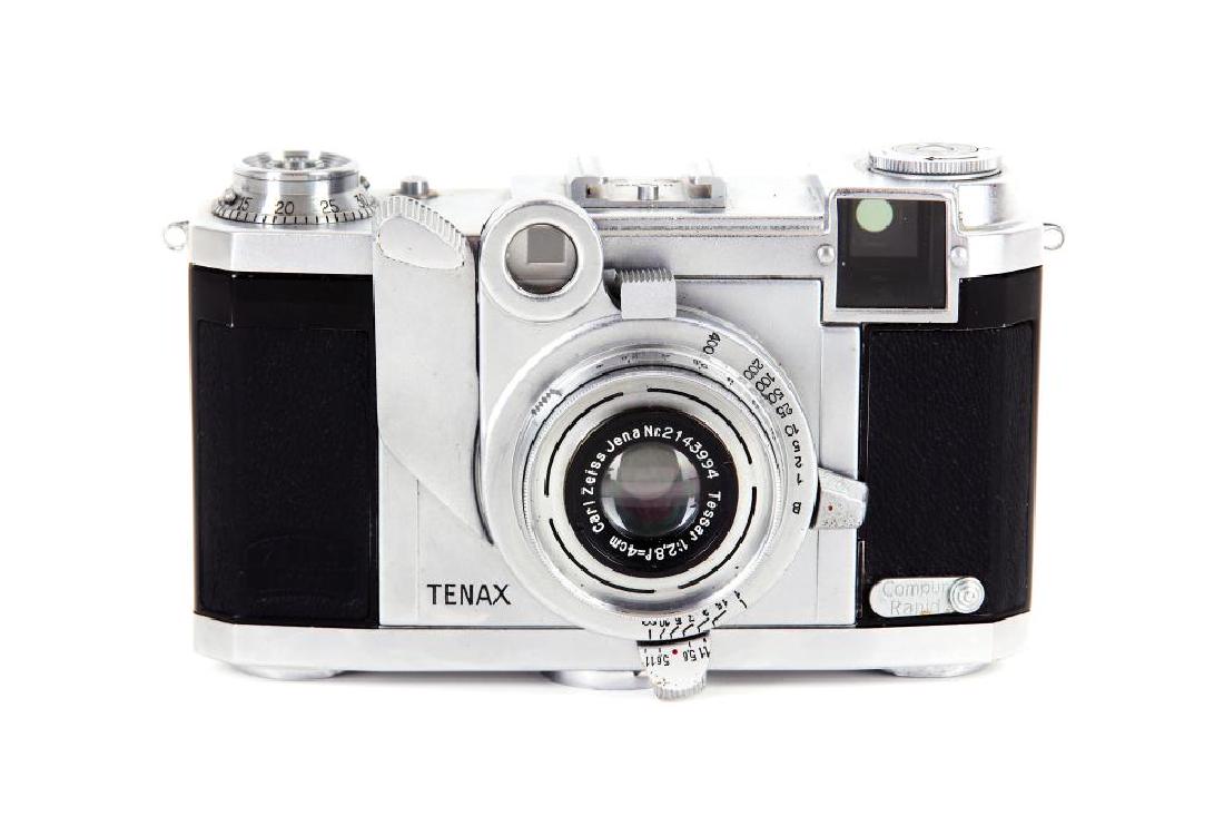 A Zeiss Ikon Tenax II Rangefinder Camera: A Zeiss Ikon Tenax II Serial No: H.75026 Date: 1938-41 Shutter: working Body: VG/E Lens: Carl Zeiss Jena 4cm f/2.8 Tessar Serial No: 2143994 Optics: VG, cleaning marks Notes: 24x24mm exposures on 35mm