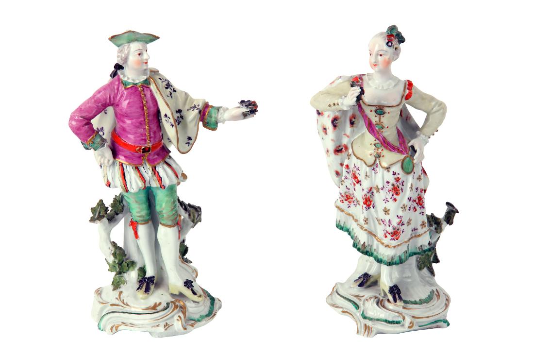 A pair of Derby porcelain figures of the Ranelagh: A pair of Derby porcelain figures of the Ranelagh Dancers, circa 1770, both modelled standing in a dancing pose, he wearing a tricorn hat, plume missing, pink doublet, green hose, and a yellow cloak,