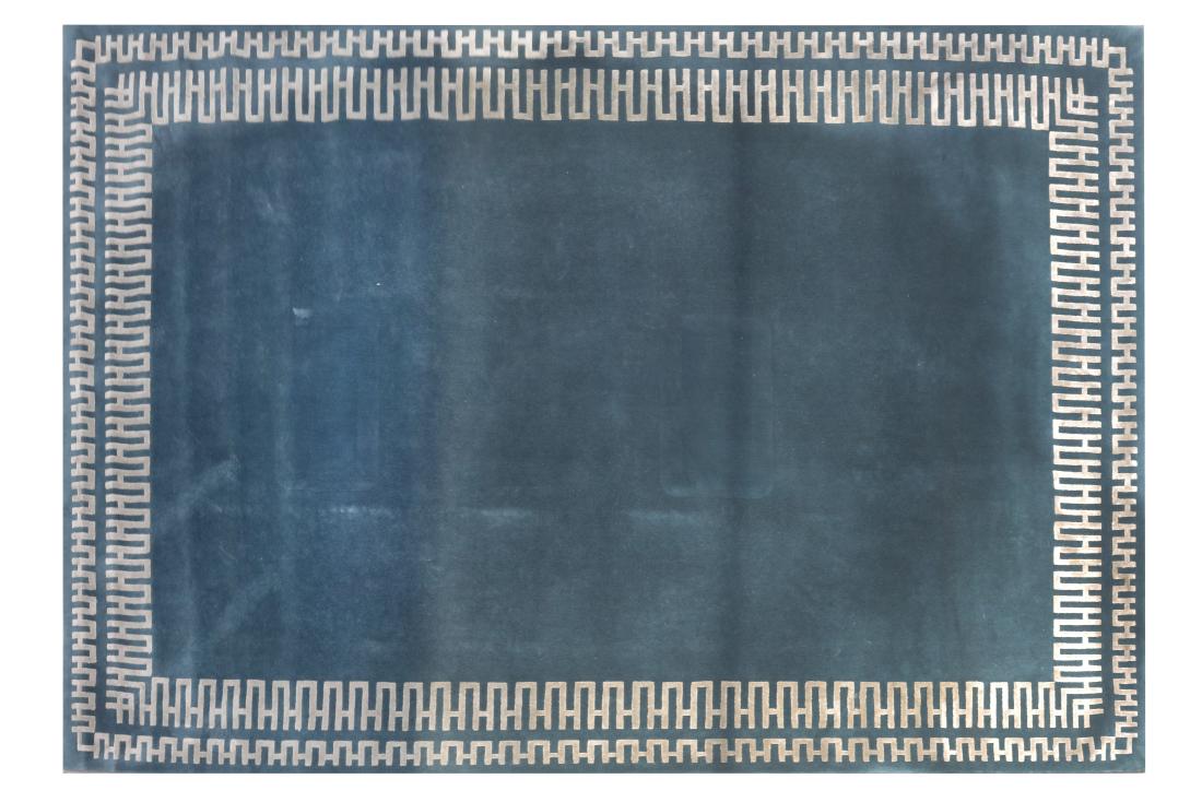 An Edward Fields wool and silk rug, designed with a: An Edward Fields wool and silk rug, designed with a silver geometric pattern against a teal ground, 305 x 423cm, 10' x 14', 81.5% wool and 18.5% silk