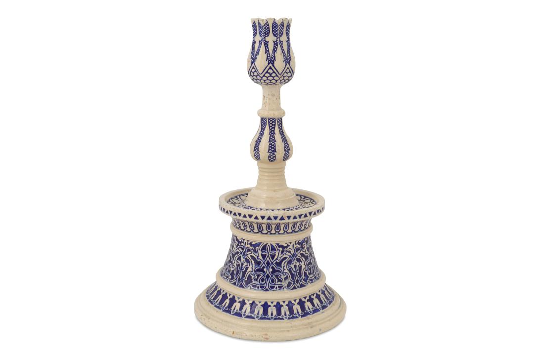 AN OTTOMAN-STYLE BLUE AND WHITE POTTERY CANDLESTICK: AN OTTOMAN-STYLE BLUE AND WHITE POTTERY CANDLESTICK Marked Theodore Deck, France, late 19th century Of typical Ottoman shape, resting on a tall splayed and stepped foot, with a bulbous shaft rising to