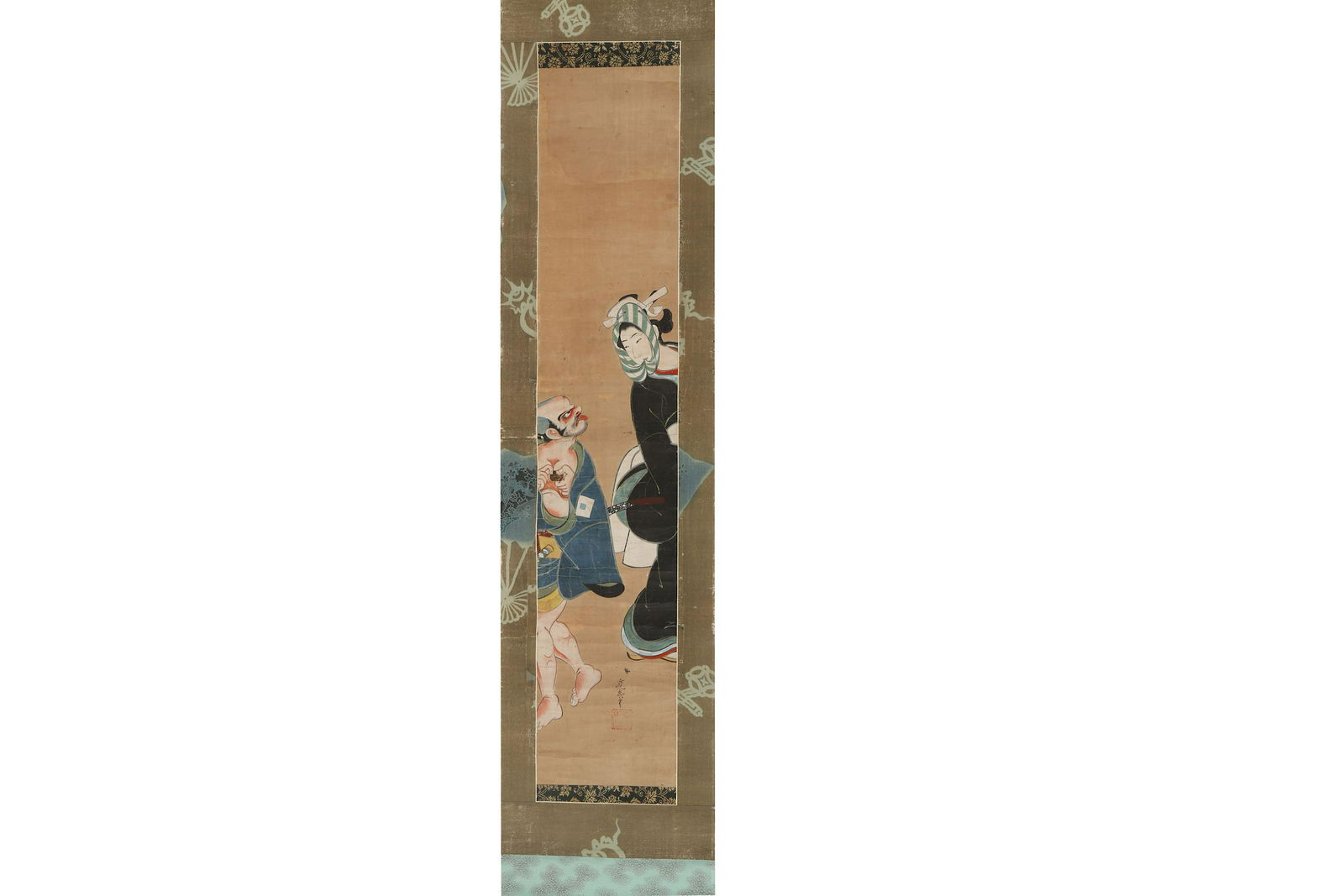 A JAPANESE HANGING SCROLL ATTRIBUTED TO TOENSAI KANSHI.: ATTRIBUTED TO TOENSAI KANSHI. 18th Century. Hashira-e, painted in ink and colour on paper, mounted as a hanging scroll, depicting a humorous scene with a male servant (yakko) sticking his tongue out t