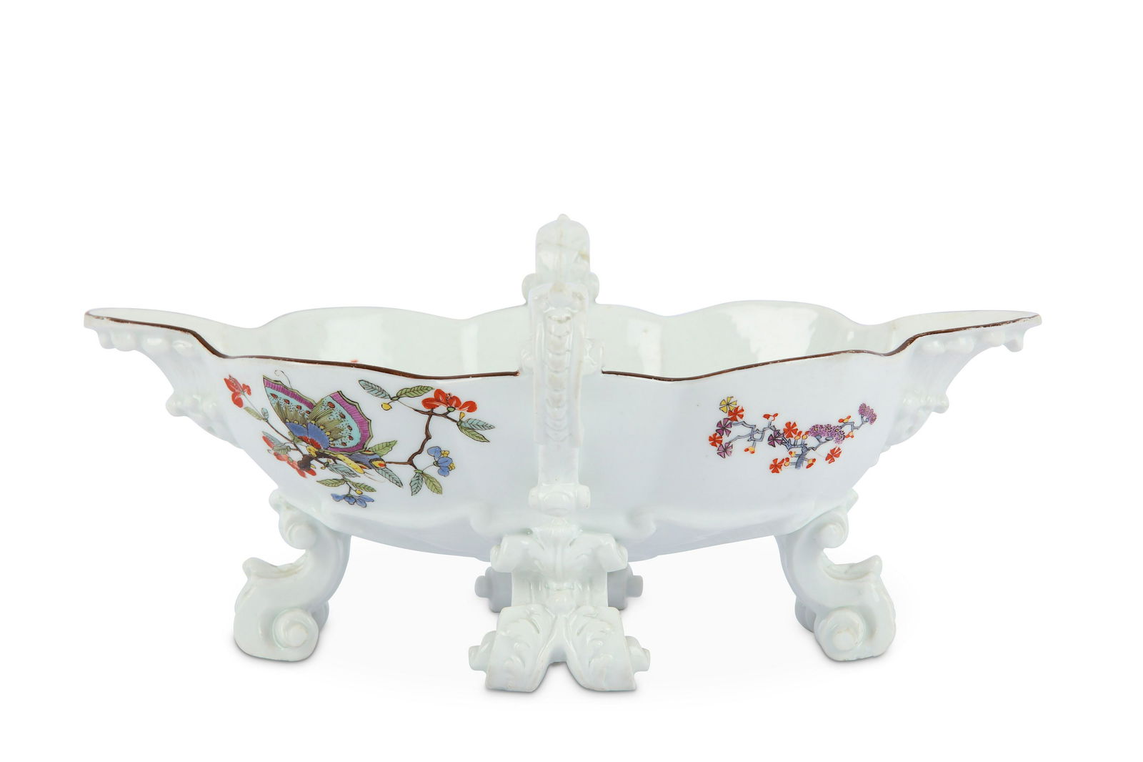 A Meissen Porcelain Kakiemon twin handled double l: A Meissen porcelain Kakiemon twin handled double lipped sauceboat, circa 1735, blue crossed swords mark and Drehers mark, painted in the Schmetterling pattern with a brown line rim, width 24.2cm