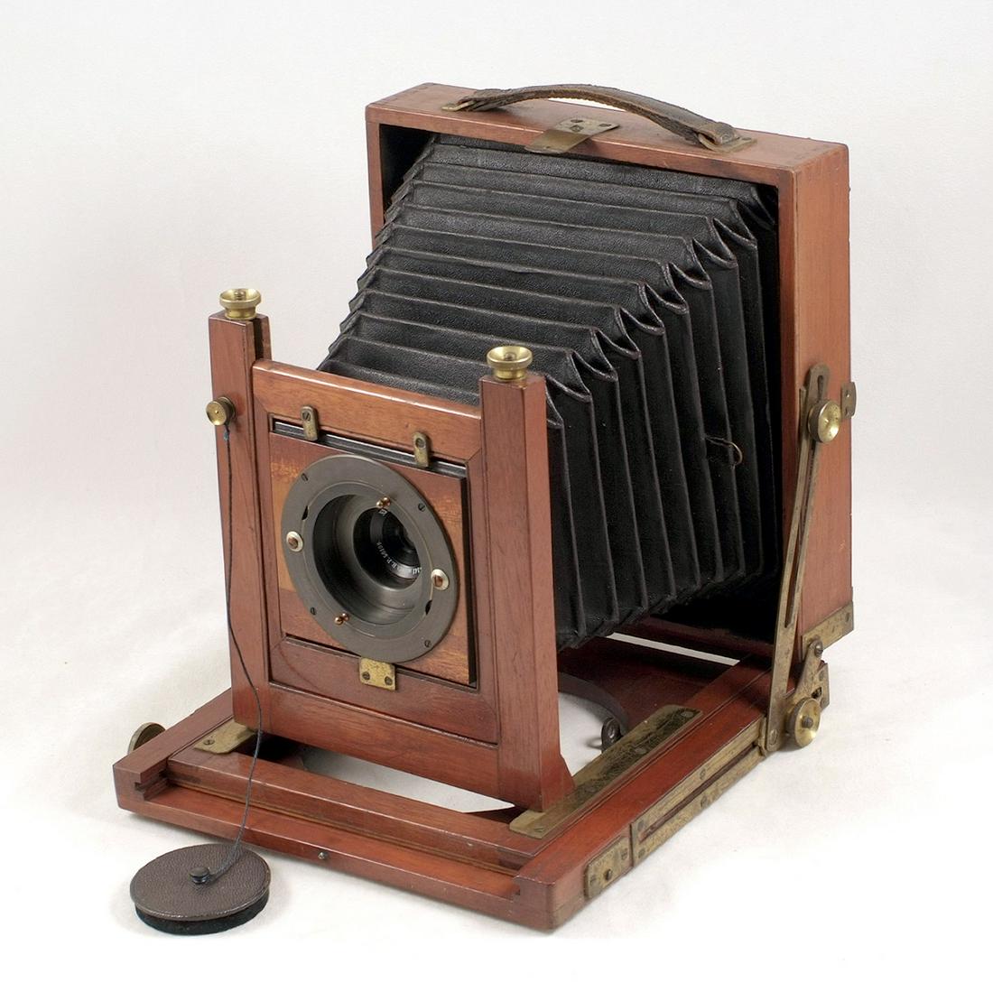 An Un-named Half Plate Field Camera with Unusual Wide: An Un-named Half Plate Field Camera with Unusual Wide Angle Lens With brass Anastigmat 1:18 f141mm D.R.P. 56109 lens No.30694 with Waterhouse stops in deeply recessed panel. No makers name on lens, bu