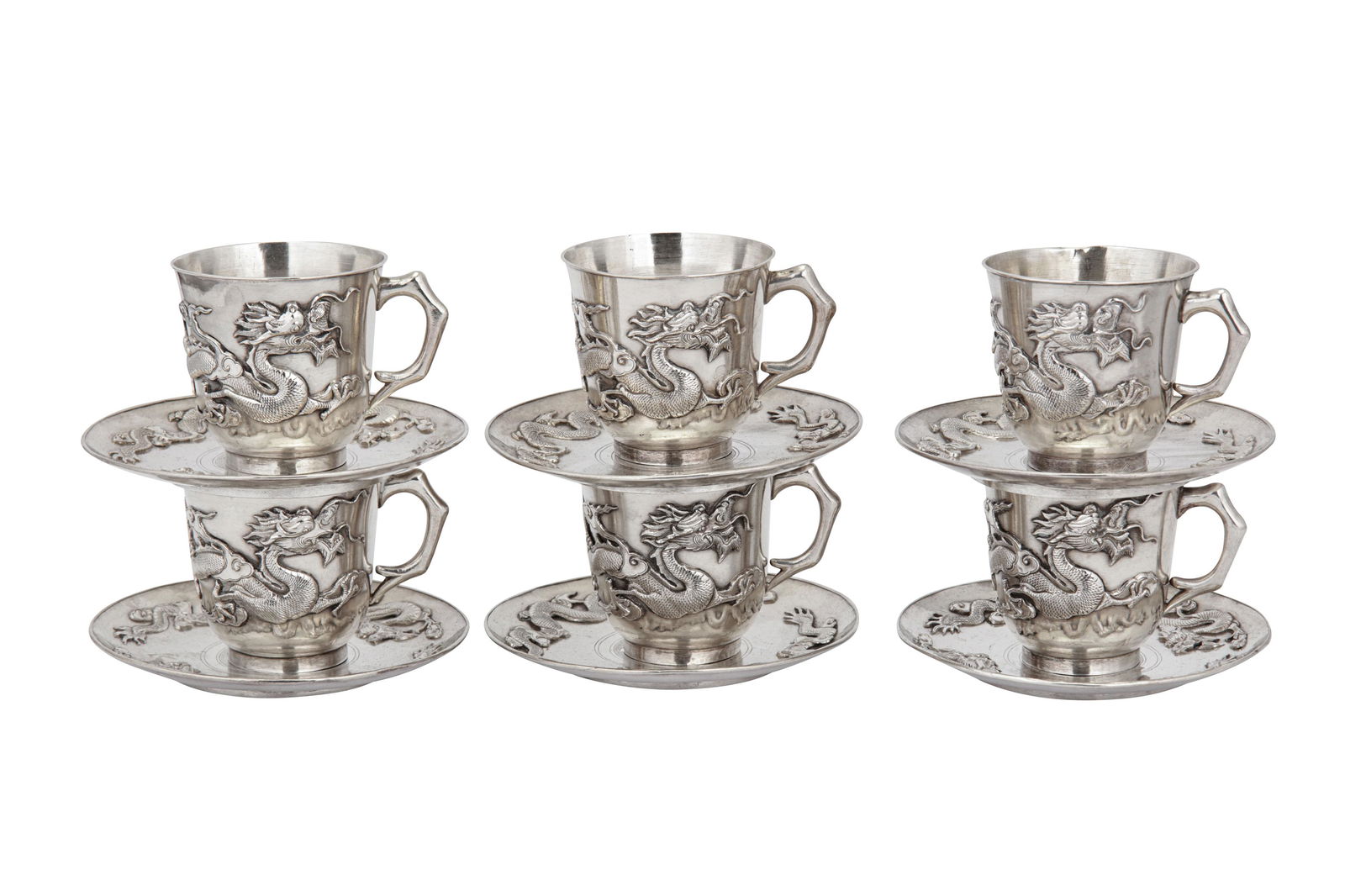 A set of late 19th / early 20th century Chinese export: A set of late 19th / early 20th century Chinese export silver cups and saucers, Shanghai circa 1900 Qing dynasty, comprising six cup and six saucers the cups of circular form with rounded base upon a