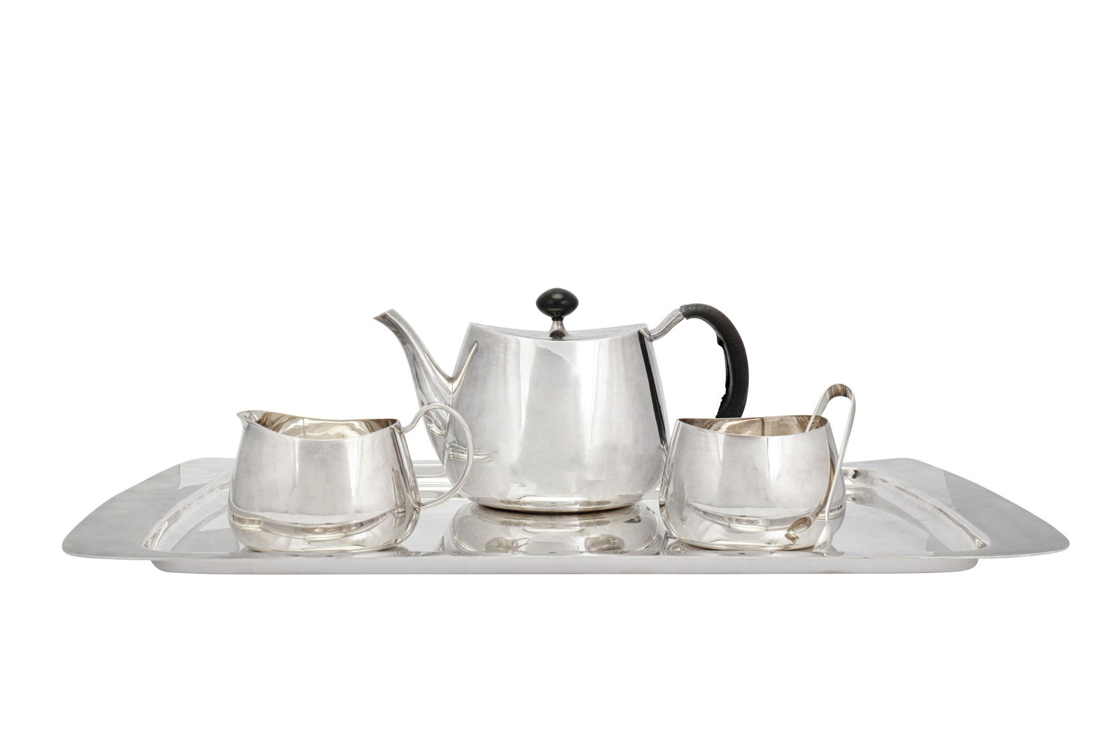 An Elizabeth II modernist sterling silver three-piece: An Elizabeth II modernist sterling silver three-piece tea service, Sheffield 1959/61/62 mark of Walker and Hall, designed by David Mellor Pride pattern, of plain ogee form, comprising a teapot (1962),