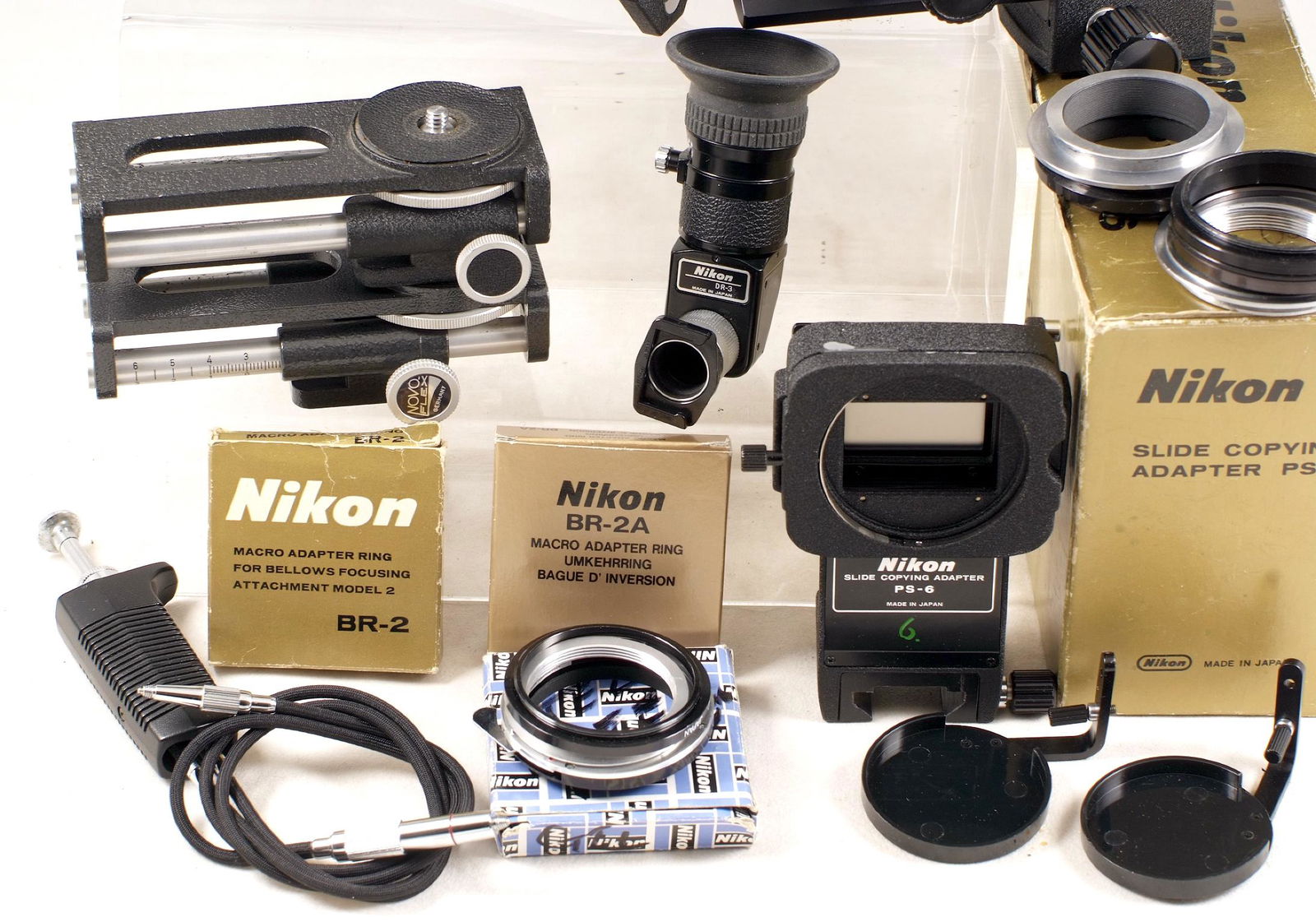 Nikon PB-6 & Other Bellows Units: Nikon PB-6 & Other Bellows Units. Comprising Nikon PB-6 bellows with twin cable release, PS-6 Slide Copying Adapter, right-angle finder and various adapter rings etc. Also a set Nikon fit AICO bellows