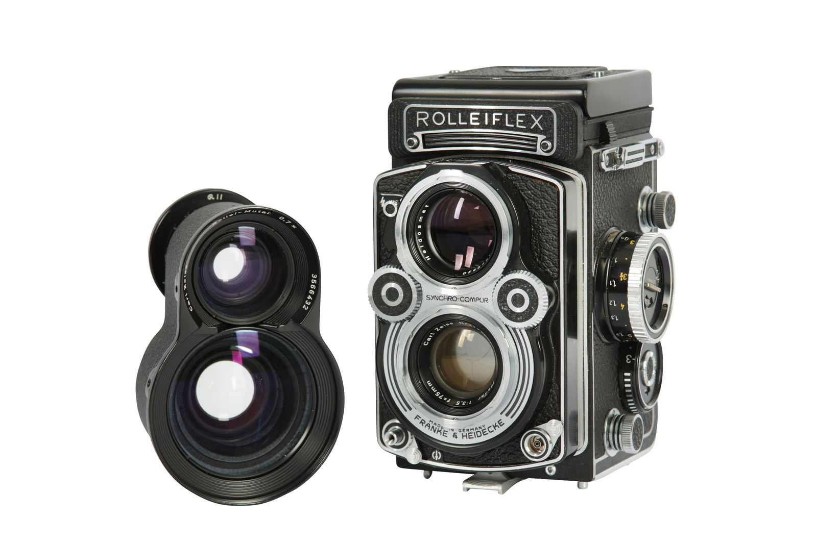 A Rolleiflex 3.5F TLR Camera: A Rolleiflex 3.5F TLR Camera Serial No: 2832604 Body: VG/E Shutter: working, sluggish at slowest speeds Lens: Carl Zeiss 75mm f/3.5 Planar (4774694) Optics: VG/E Notes: complete with Rollei Mutar 0.7x