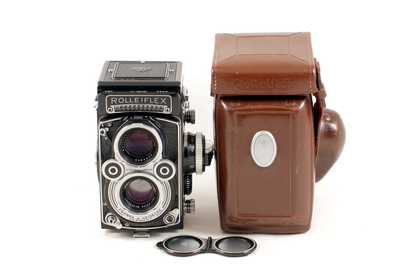 A Metered Rolleiflex 3,5F: A Metered Rolleiflex 3,5F #2231524. With CZ Planar 75mm f3.5 lens. (Shutter firing and meter working, signs of light use). With cap, strap and ERC.