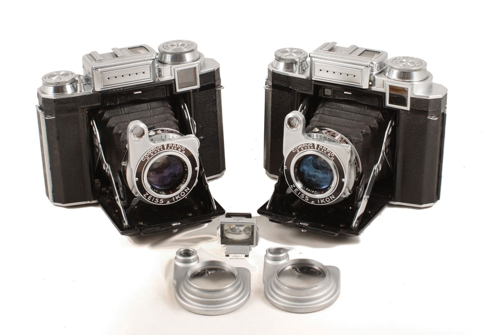 A Pair of Zeiss 533/16 Super Ikonta A Cameras.: A Pair of Zeiss 533/16 Super Ikonta A Cameras. Each with 80mm f2.8 Tessar. Both with signs of light use, shutters firing, meters not responding. One with ERC. Also close-up lenses 1 & 2 and an uncommo