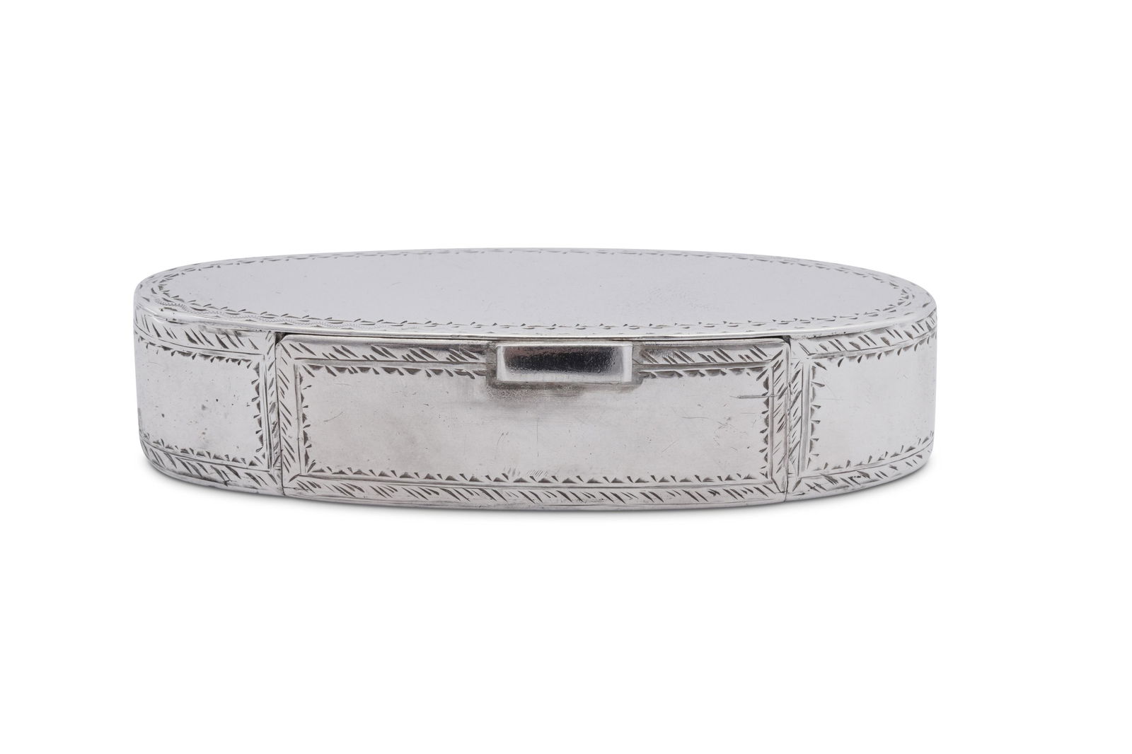 A George III Irish silver snuff box, Dublin circa 1770: A George III Irish silver snuff box, Dublin circa 1770 by James Kennedy (active 1768-1803) Elliptical form with a hinged flush lid raised by a block thumbpiece. Bright cut engraved decorative bands. M