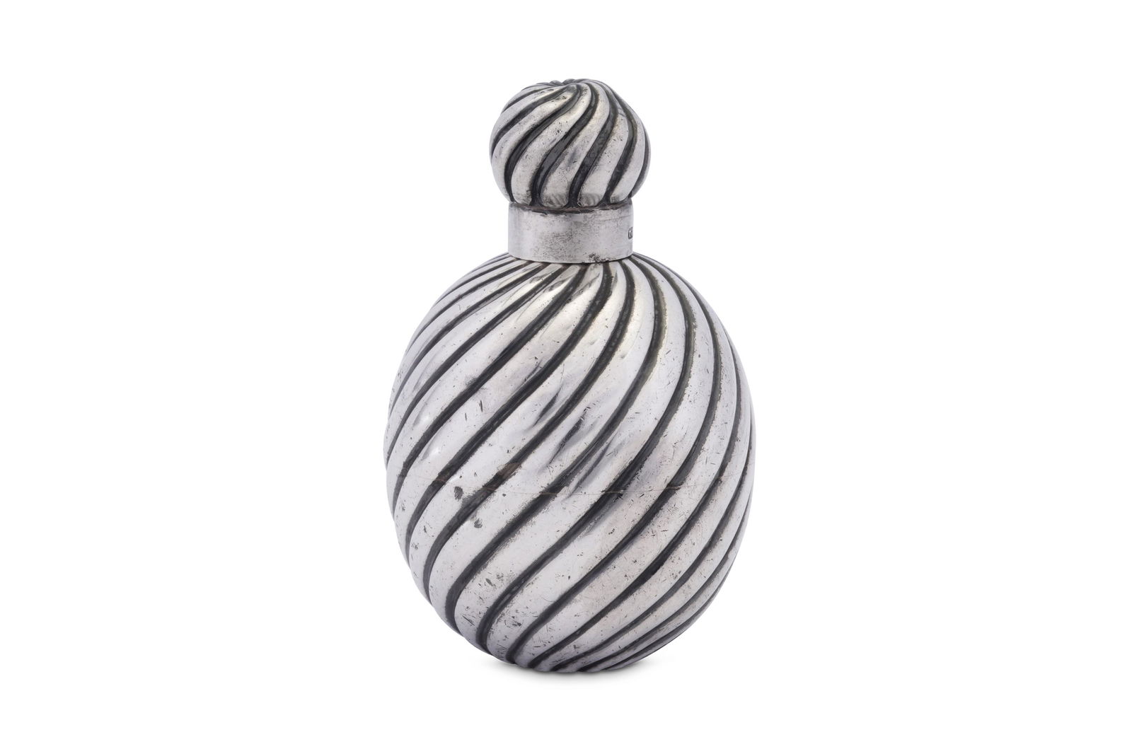 A Victorian sterling silver scent bottle, London 1885: A Victorian sterling silver scent bottle, London 1885 by Thomas Johnson II Of ovoid form and a globular screw cap, each with wrythen fluted decoration. Engraved underneath Sallie. Fully marked to neck