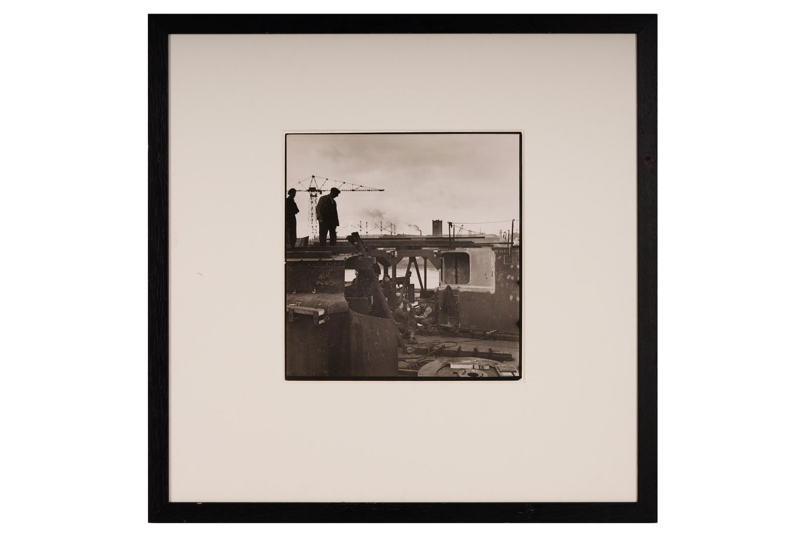 Cecil Beaton (1904-1980): Cecil Beaton (1904-1980) MEN WORKING AT TYNESIDE SHIPYARD FOR THE WAR EFFORT. c.1943, vintage silver gelatin print, image size, 265 x 255mm, with press markings verso, framed