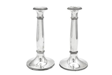 A pair of early 19th century Austrian 13 loth (812: A pair of early 19th century Austrian 13 loth (812 standard) silver candlesticks, Vienna circa 1826 or 28 by Thomas Müller (active 1820-64) Spreading circular bases with gently baluster columns w