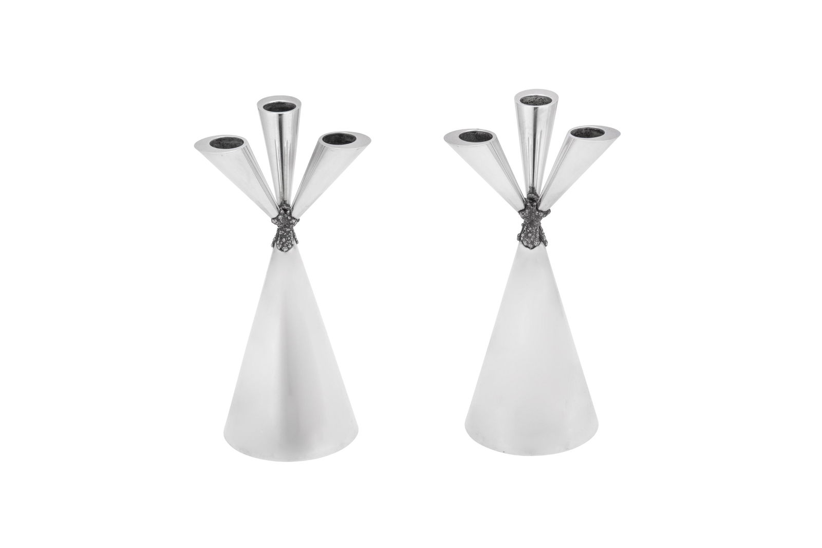 A pair of Elizabeth II modernist sterling silver: A pair of Elizabeth II modernist sterling silver candelabra, London 1973 by George Grant McDonald, retailed by Aspreyâ€™s Each of conical form with three conical branches with cylindrical recesse