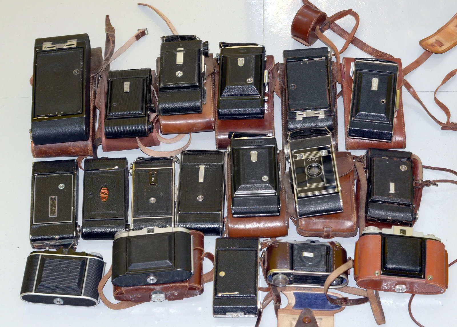 A Group of 18 Kodak and Other Folding Cameras.: A Group of 18 Kodak and Other Folding Cameras. To include Zeiss, Ensign and others. Conditions vary from good to very good. Most with cases.