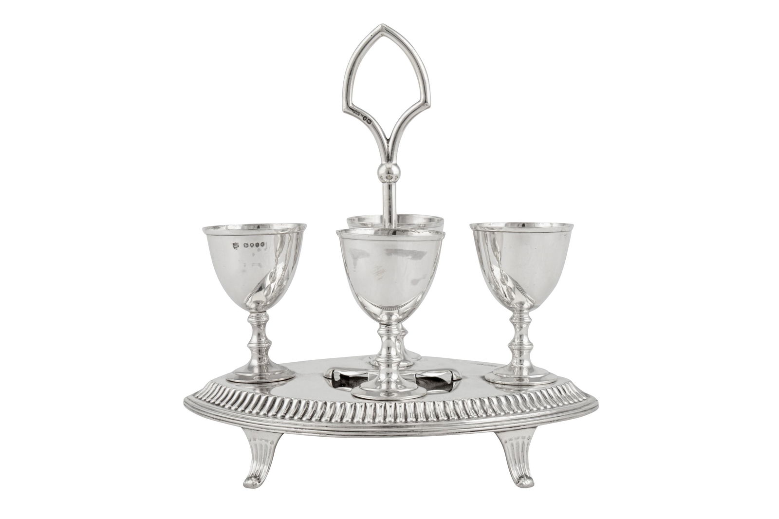 A Victorian sterling silver egg cruet, London 1887 by John Aldwinckle and Thomas Slater: A Victorian sterling silver egg cruet, London 1887 by John Aldwinckle and Thomas Slater the elliptical base raised upon four reeded splay feet, with a detachable central carrying handle with four spoo