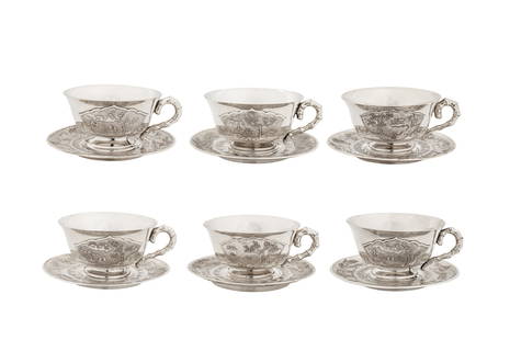 A set of six mid-20th century Vietnamese silver tea cups and saucers, Hanoi circa 1960: A set of six mid-20th century Vietnamese silver tea cups and saucers, Hanoi circa 1960 Comprising six cups and six saucers, each of circular form. The cups with handles modelled as bamboo. Each with