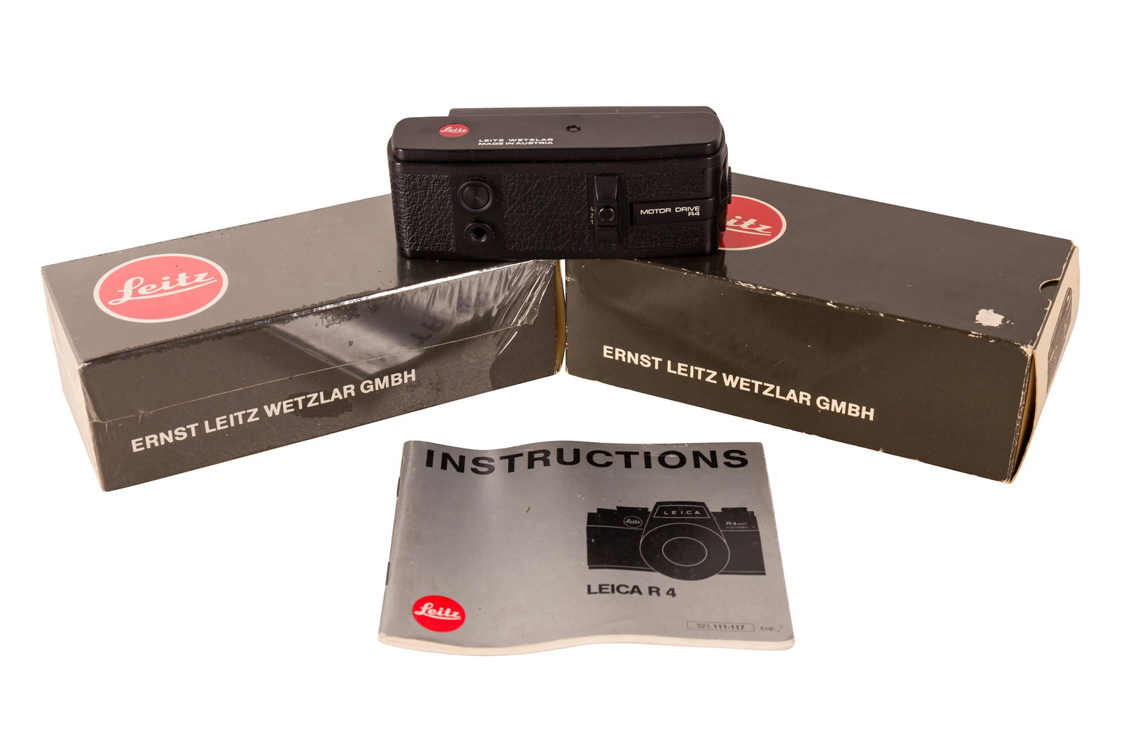 A Pair of Leica R4 Winders.: A Pair of Leica R4 Winders. Motor winder R4 #38980: wear to baseplate, untested, boxed. Motor drive R4: minor wear, untested, boxed. Leica R4 manual.