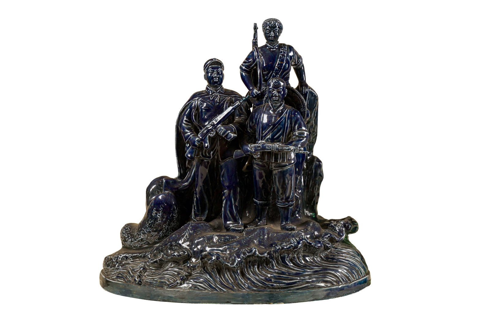 A Large Chinese Cultural Revolution Era Blue-glazed Figural Group: A Large Chinese Cultural Revolution Era Blue-glazed Figural Group, late-1960s, modelled to depict three People?s Liberation Army soldiers on coastal defense duty, the figures over an integral naturali