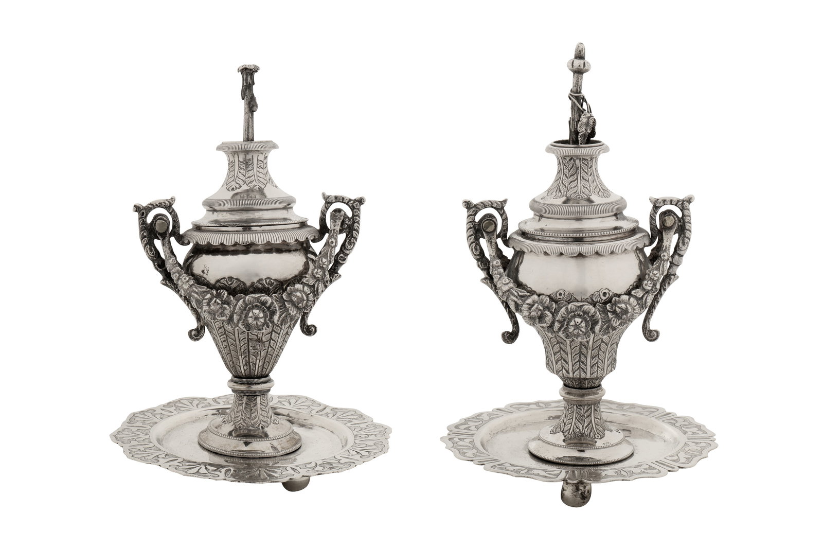 A pair of mid-19th century Ottoman Turkish silver candy or incense vases, Tughra of Sultan Abdul: A pair of mid-19th century Ottoman Turkish silver candy or incense vases, Tughra of Sultan Abdul Mecid (1839-61) Each upon a shaped circular dished base upon three ball feet, with flat chased scroll e