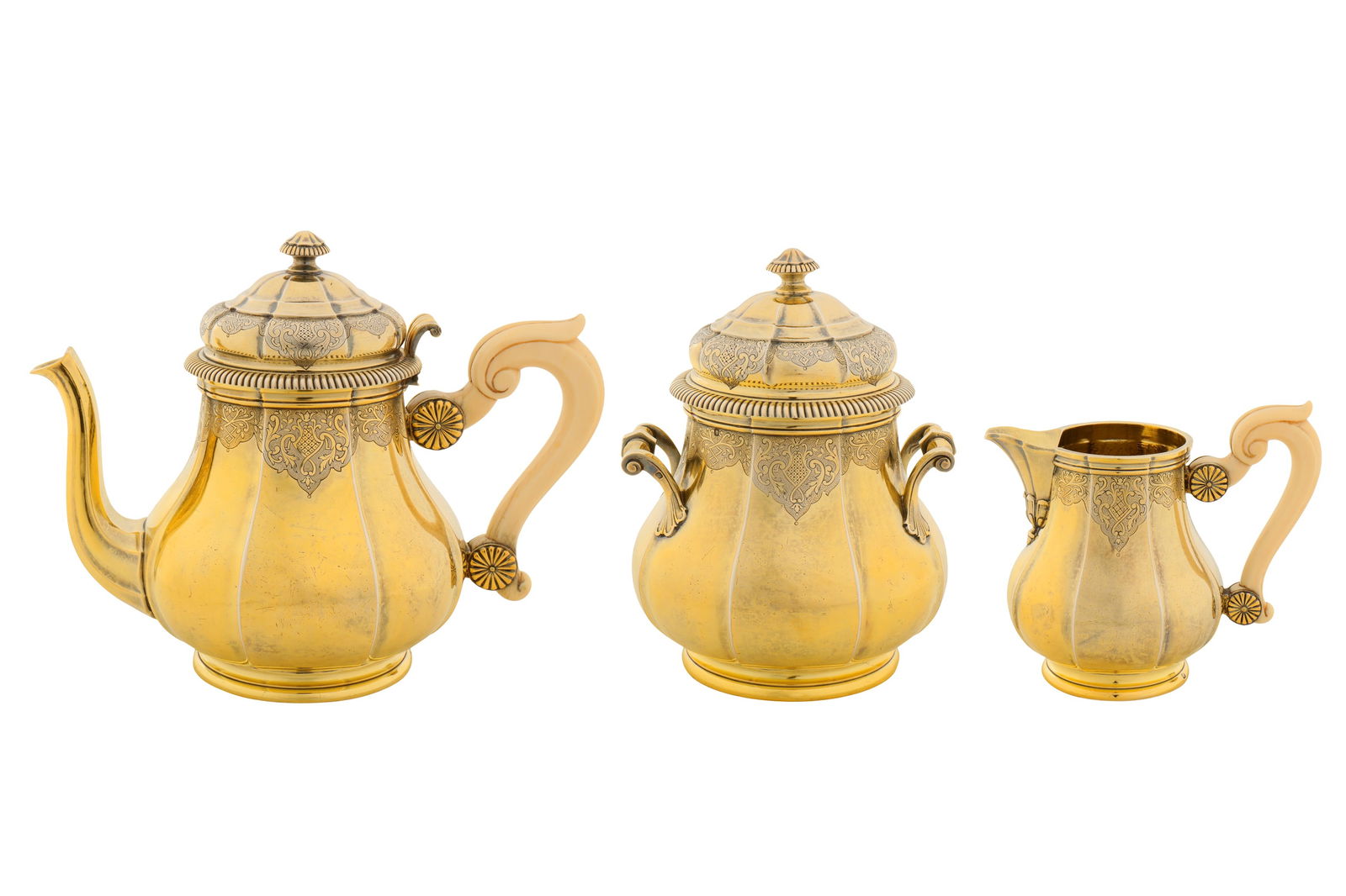 A late 19th century French 950 standard silver gilt three-piece tea service, Paris circa 1890 by (1 of 8)