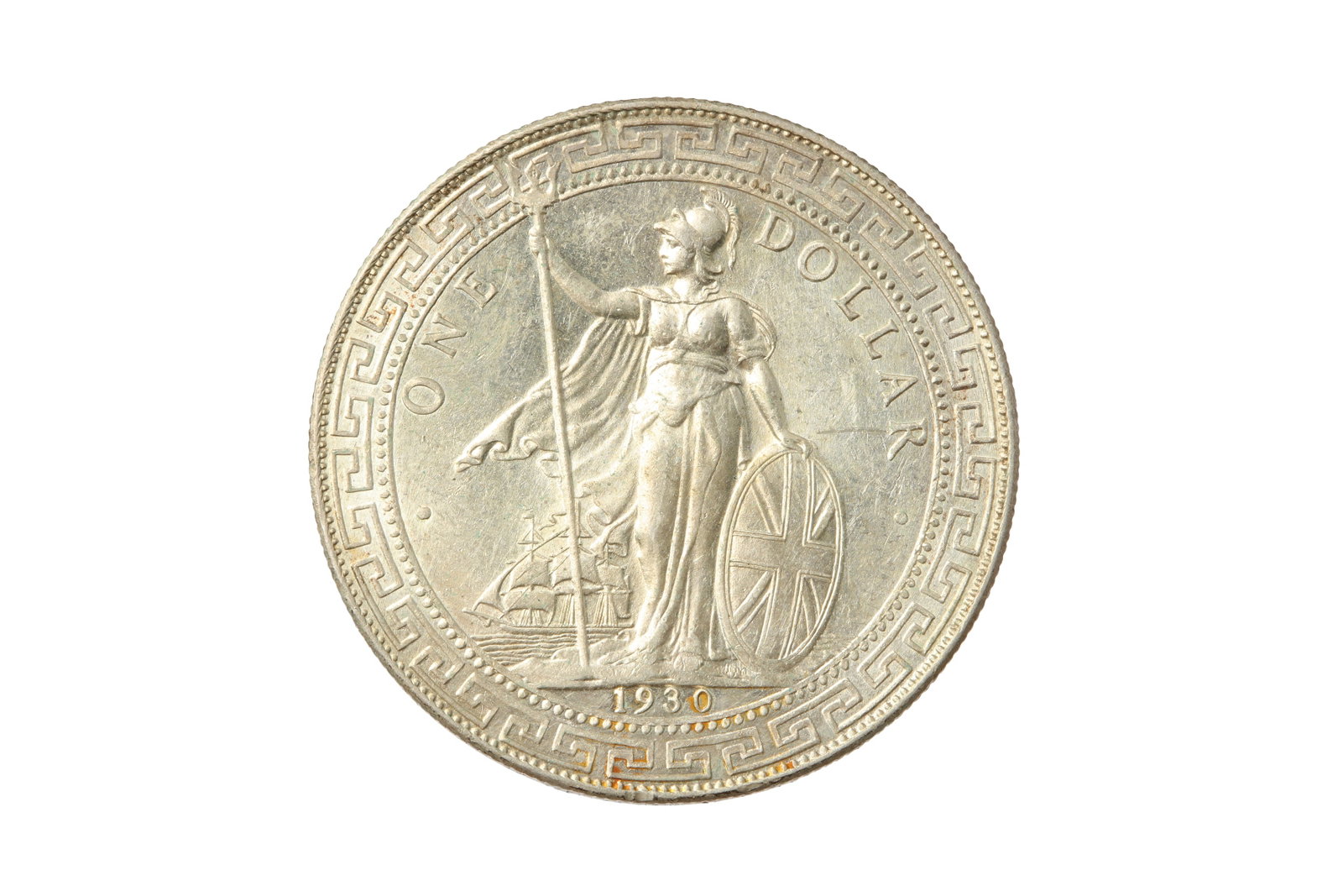 HONG KONG, 1930-B TRADE DOLLAR.: HONG KONG, 1930-B TRADE DOLLAR. Bombay mint. Obv: Figure of Britannia standing facing left, holding trident in right hand, shield emblazoned with The Union flag in left hand, merchant ship to left, 19