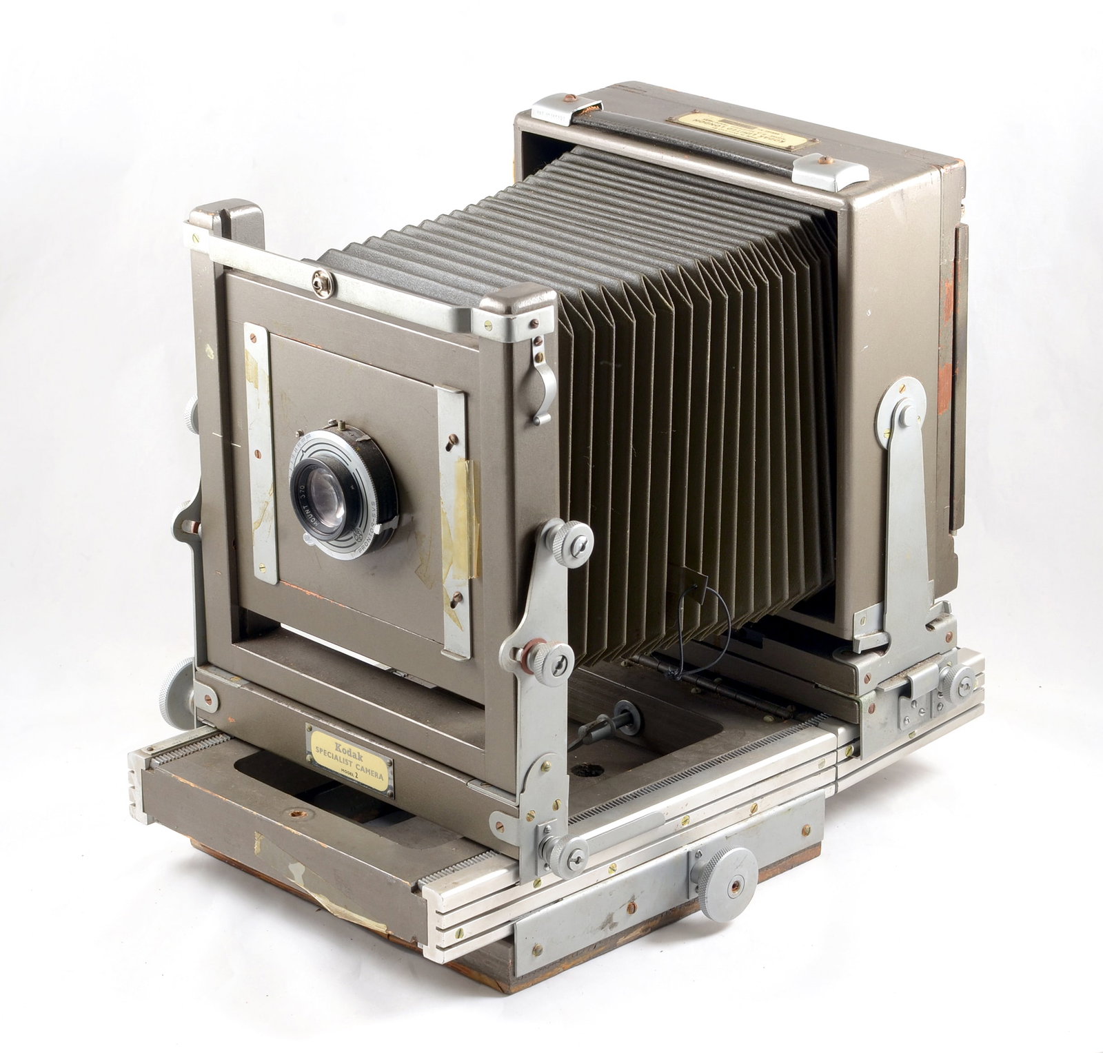 Kodak Specialist Model 2 Half Plate Studio Camera.: Kodak Specialist Model 2 Half Plate Studio Camera. With Ektar 203mm f7.7 lens in a Prontor SVS (working) shutter. Some loss of veneer to underside of rail bed and bellows very dry, otherwise signs of