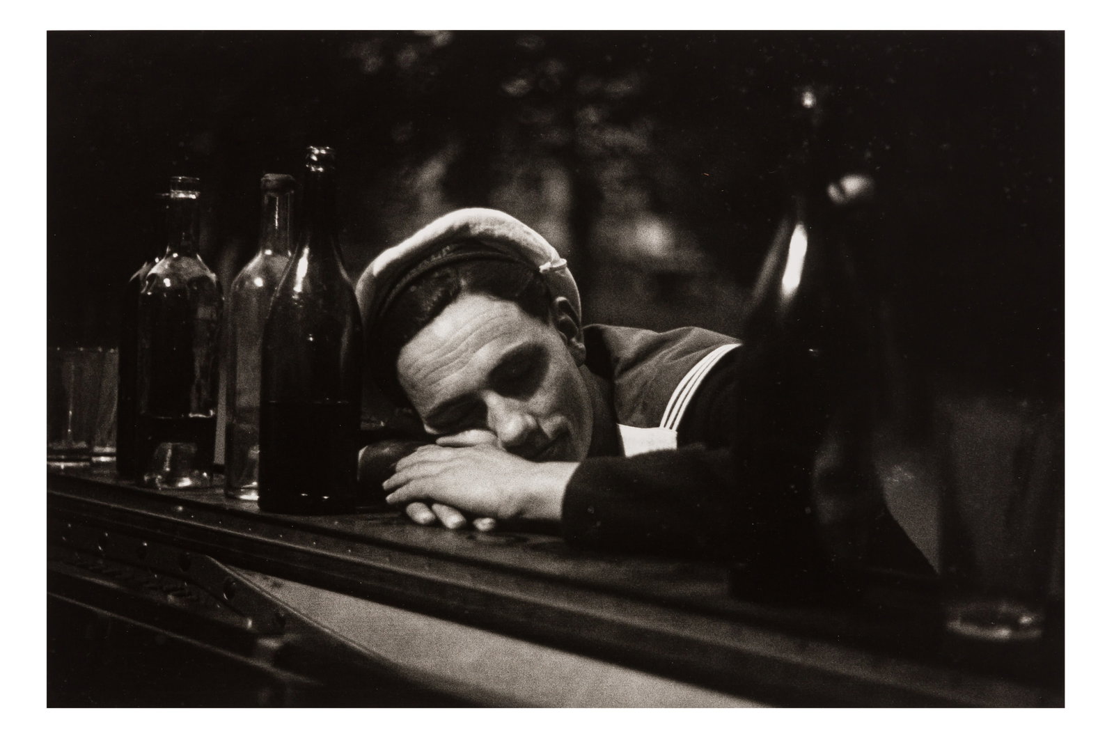 § Jean-Philippe Charbonnier (1921-2004): Jean-Philippe Charbonnier (1921-2004) SAILOR ASLEEP ON THE PIANO, PLACE DU BOURG-TIBOURG, PARIS, 4TH, c.1945. Silver gelatin print, printed 1989 by Herve Hudry, image size 240 x 360mm, sheet size 305