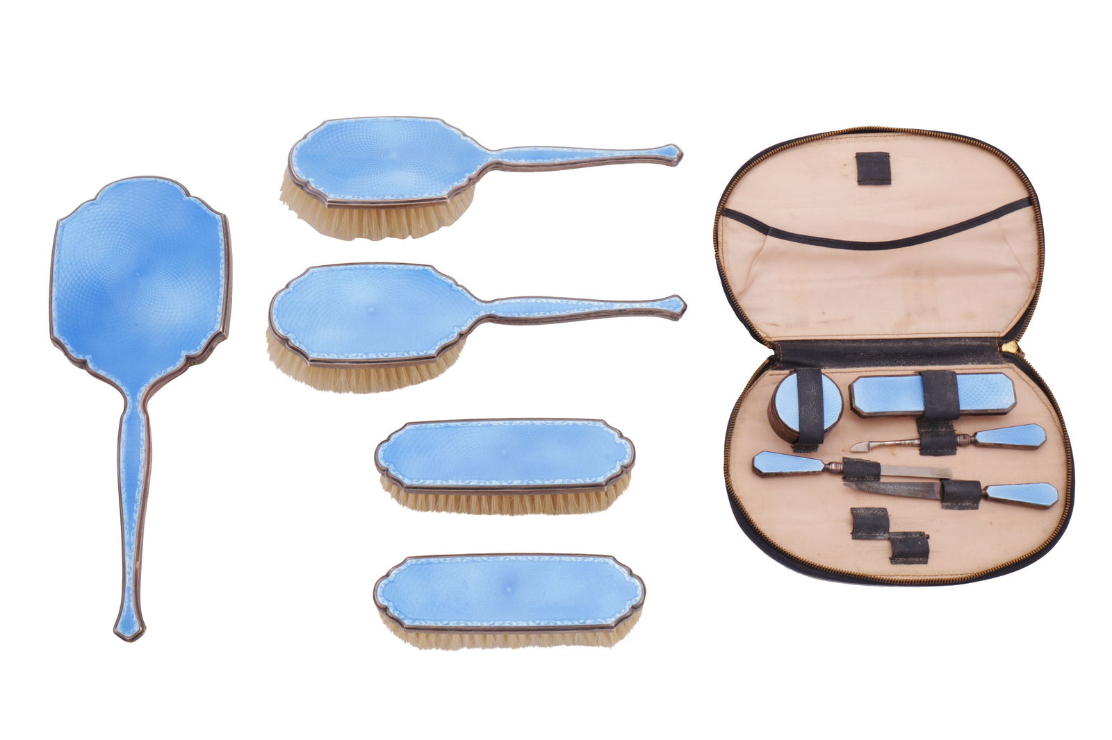 A George V sterling silver and guilloche enamel dressing table set, London 1933 by Richard Comyns: A George V sterling silver and guilloche enamel dressing table set, London 1933 by Richard Comyns Comprising a hand mirror, two clothes brushes, and two hair brushes. Together with a similar cased man