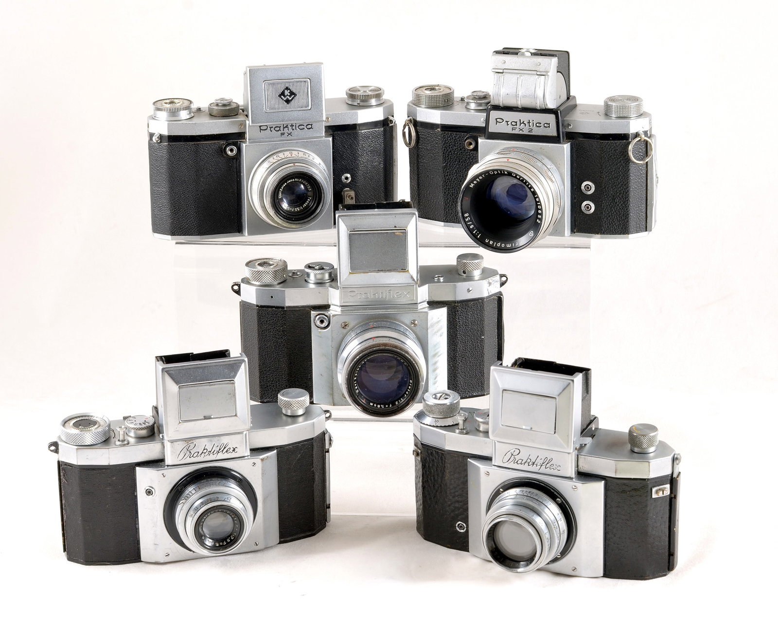 Five KW Praktiflex Cameras with Waist Level Finders.: Five KW Praktiflex Cameras with Waist Level Finders. Comprising Praktiflex with f2.8 Viotor, Praktiflex with f2 Tessar, comprising Praktiflex with f2 Biotar, Praktiflex FX with f3.5 Tessar and a Prakt