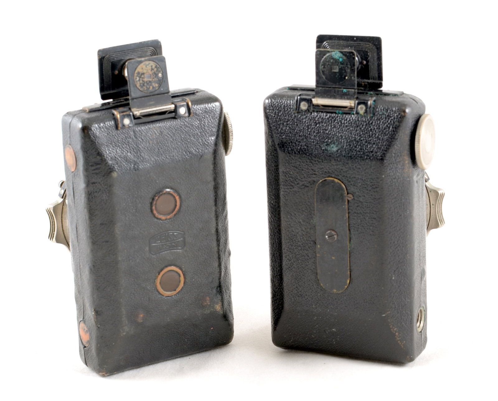 A Pair of Zeiss Ikon Kolibri Cameras, with Support Feet.: A Pair of Zeiss Ikon Kolibri Cameras, with Support Feet. Rim-set shutter version with 5cm Novar lens, shutter firing, (signs of heavy use & stiff to open) and a Compur shutter version with a Zeiss 50m